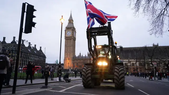 Farmers take part in a tractor "go-slow" through Parliament Square, Westminster, to raise awareness of the difficulties for the British farming industry which are putting food security at risk.