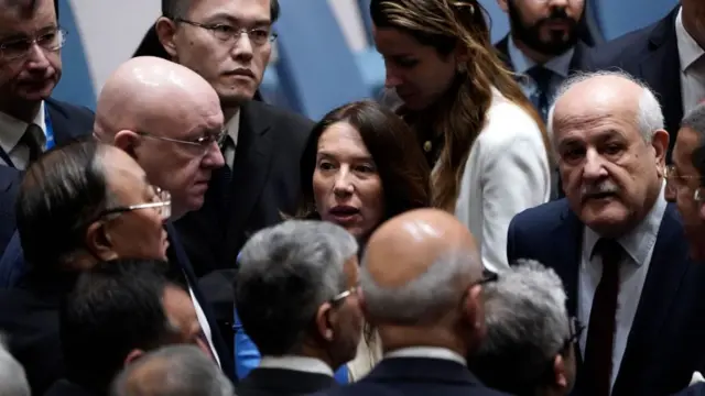 Permanent representatives to the UN, Ambassadors, Zhang Jun of China, Vassily Nebenzia of the Russian Federation,Vanessa Frazier of Malta and Riyad Mansour of Palestine confer during a UN Security Council meeting