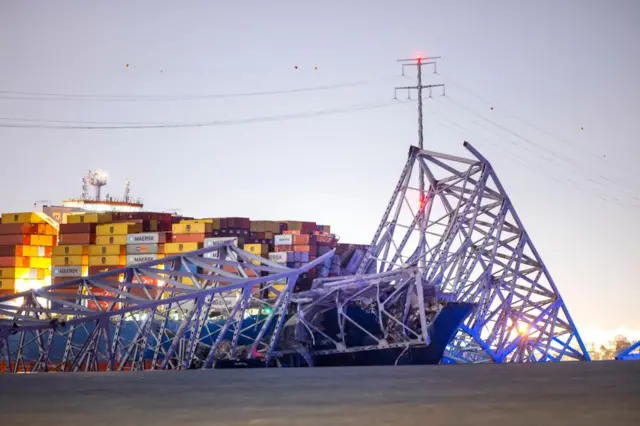 The Francis Scott Key Bridge rests partially collapsed after a cargo ship (Dali) ran into it in Baltimore, Maryland, USA, 26 March 2024.