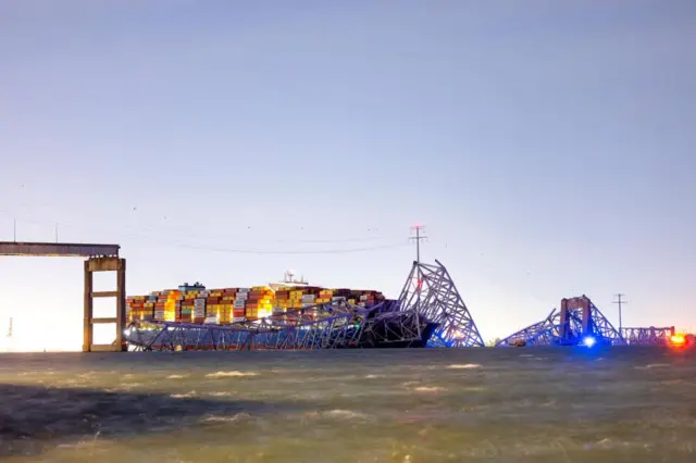 The Francis Scott Key Bridge rests partially collapsed after a cargo ship (Dali) ran into it in Baltimore, Maryland, USA, 26 March 2024.