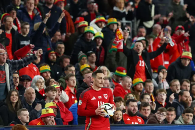 Connor Roberts of Wales prepares for a throw-in