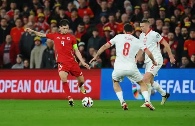 Ben Davies in action for Wales