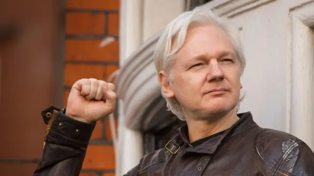 Julian Assange speaks from the balcony of the Ecuadorian embassy