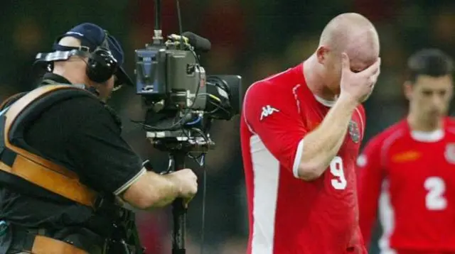 Striker John Hartson dejected after Wales' only other Euro play-offs against Russia 21 years agoImage