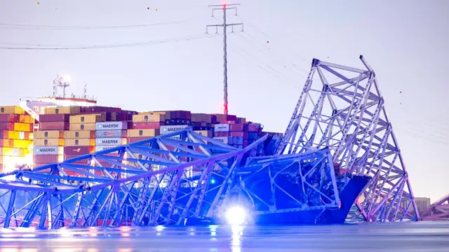 The Francis Scott Key Bridge rests partially collapsed after a container ship ran into it in Baltimore, Maryland, USA, 26 March 2024