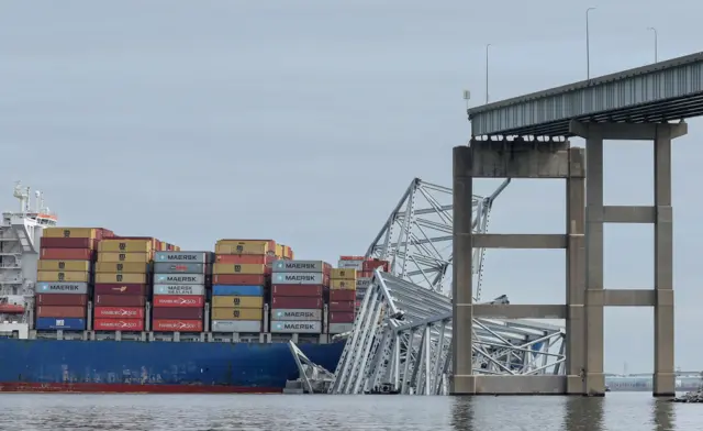 A cargo ship sits in the water after running into and collapsing the Francis Scott Key Bridge on March 26, 2024 in Baltimore,