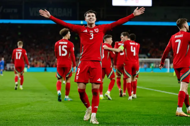 Neco Williams celebrates scoring against Finland