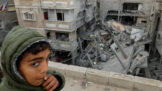 A Palestinian boy reacts near the site of an Israeli strike on a house, amid the ongoing conflict between Israel and the Palestinian Islamist group Hamas, in Rafah, in the southern Gaza Strip, March 24, 2024