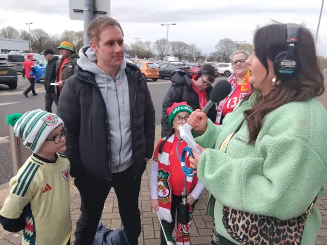 Wales fan Gareth (c) with his two children, Gethin (l) and Amelea (r).