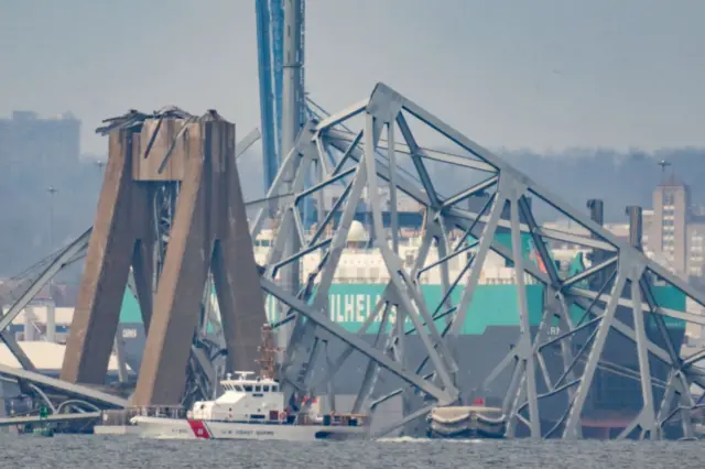 Part of the steel frame of the Francis Scott Key Bridge sits in the waters of the Patapsco River after the bridge collapsed in Baltimore, Maryland, on March 26, 2024.