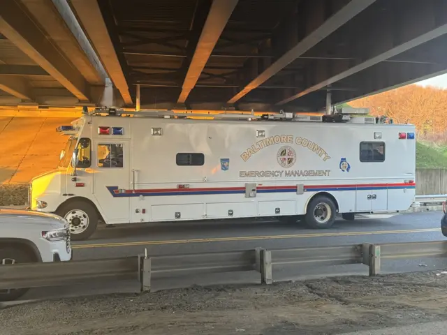 Emergency vehicle seen underneath an overpass nearby the Baltimore bridge collapse