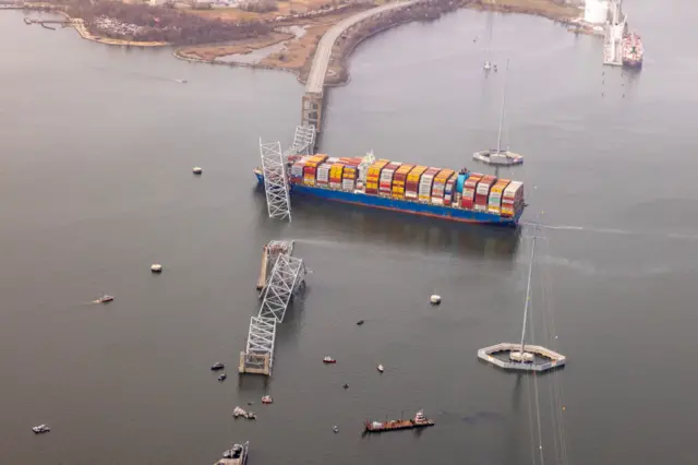 In an aerial view, cargo ship Dali is seen after running into and collapsing the Francis Scott Key Bridge on March 26, 2024 in Baltimore, Maryland. Rescuers are searching for at least seven people, authorities say, while two others have been pulled from the Patapsco River. (Photo by Tasos Katopodis/Getty Images)