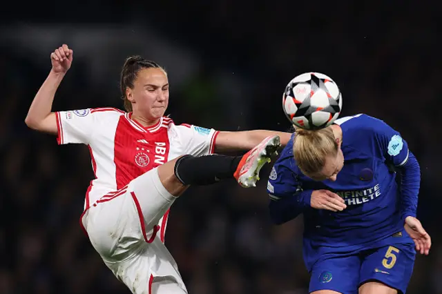 Rosa van Gool of Ajax challenges for the ball with Sophie Ingl