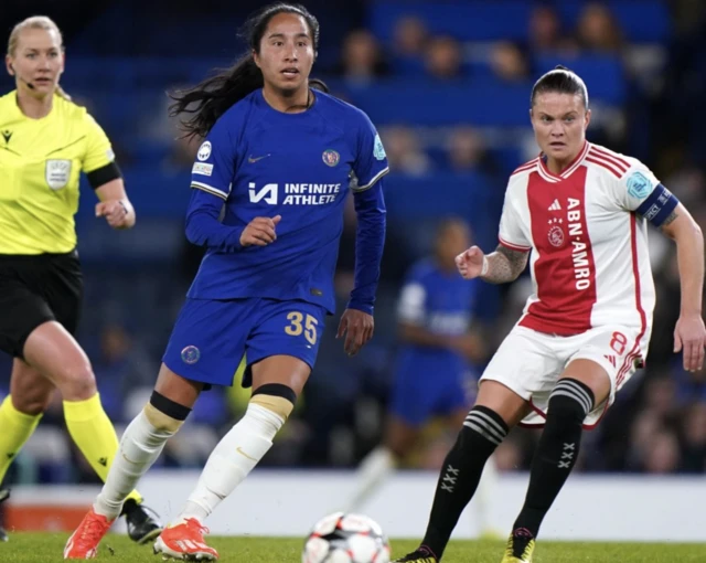 Mayra Ramirez (centre) and Ajax's Sherida Spitse (right) battle for the ball