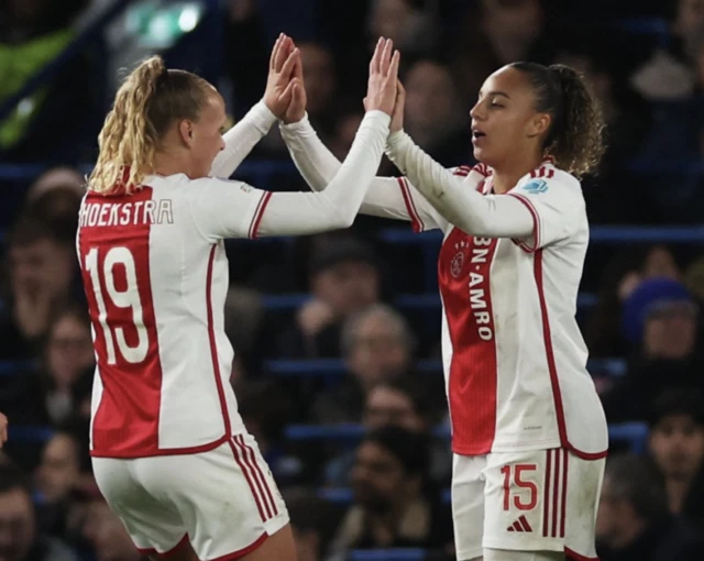 Ajax Amsterdam's Chasity Grant celebrates scoring their first goal with Tiny Hoekstra