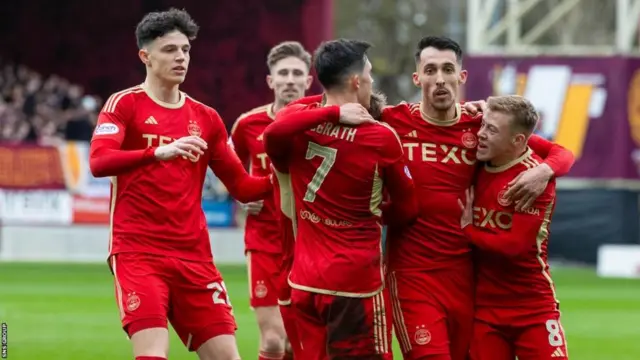 Aberdeen's players celebrate victory over Motherwell last time out