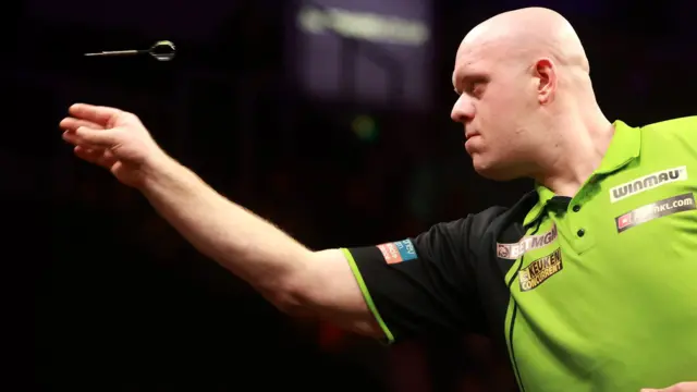 Michael van Gerwen throws a dart