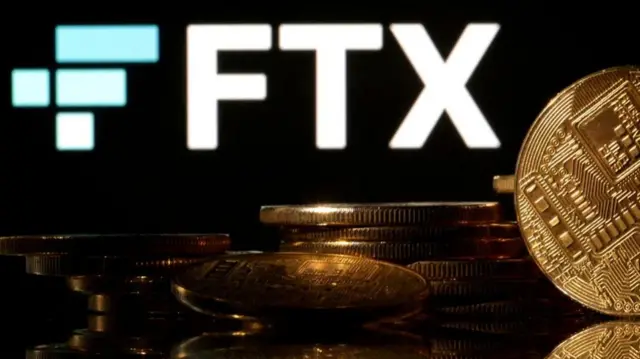 Representations of cryptocurrencies are seen in front of displayed FTX logo in this illustration taken November 10, 2022.