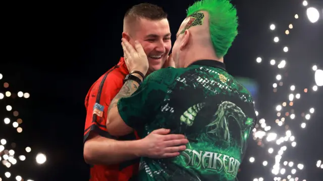 Peter Wright congratulates Nathan Aspinall