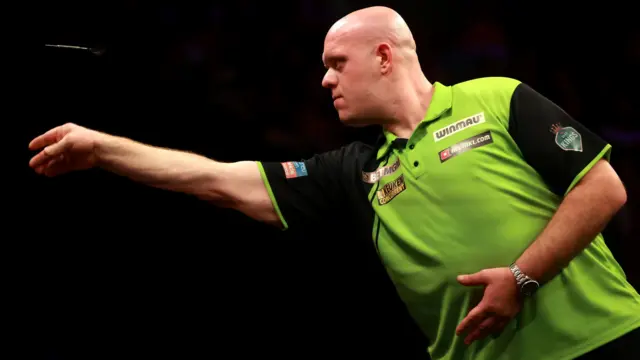 Michael van Gerwen throws a dart