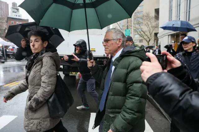 Barbara Fried and Joseph Bankman walking outside court