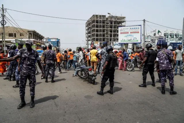 Policemen barricade access to supporters of opposition leader and presidential candidate of the National Alliance for Change (ANC) party Jean-Pierre Fabre during ANC's last election rally of the campaign in Lome on February 20, 2020