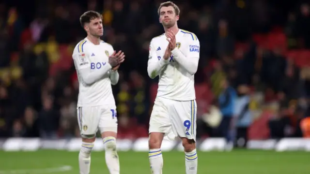 Leeds players clap at full-time