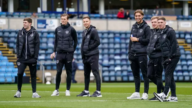 Portsmouth players on the pitch ahead of Wycombe game