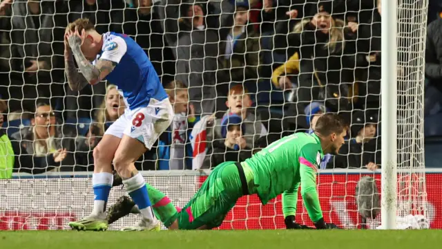 Sammie Szmodics holds his head in his hands