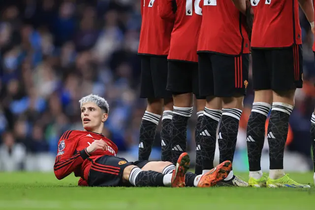 Alejandro Garnacho of Manchester United lies behind the defensive wall