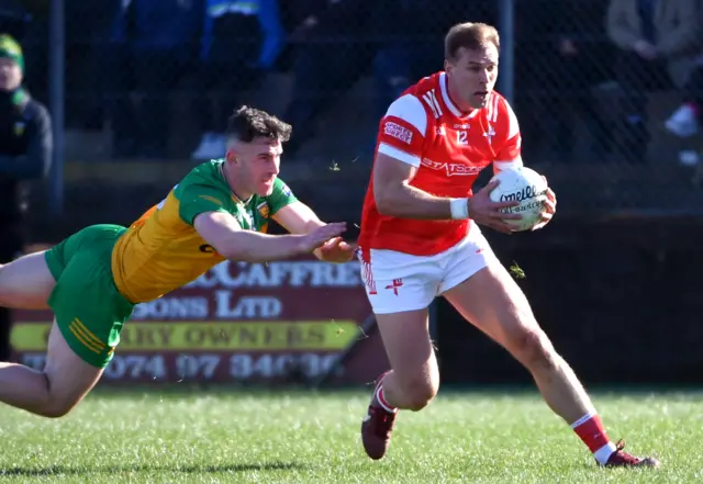 Donegal's Patrick McBrearty challenges Louth's Conor Grimes in Ballyshannon