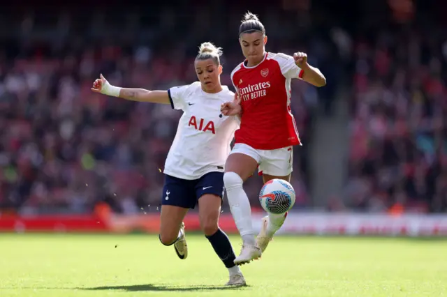 Steph Catley of Arsenal is challenged by Celin Bizet Ildhusoy