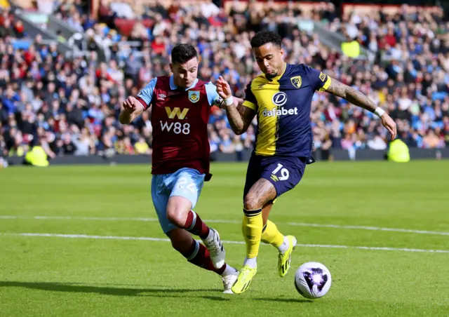 Josh Cullen (left) and Bournemouth's Justin Kluivert battle for the ball