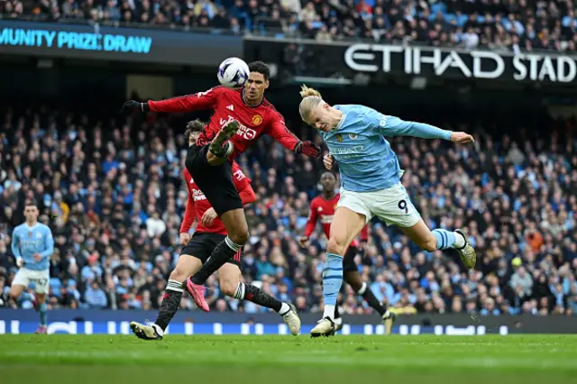 Raphael Varane of Manchester United and Erling Haaland