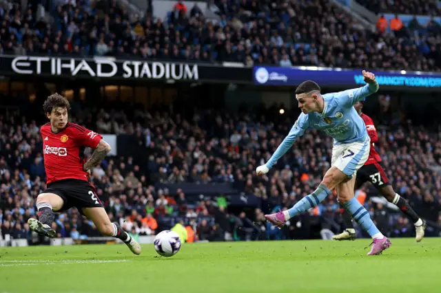 Phil Foden of Manchester City scores