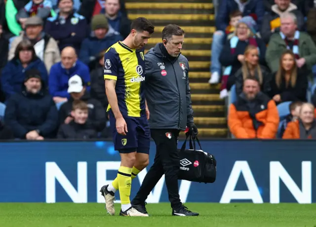 Marcos Senesi walks off after injuring himself