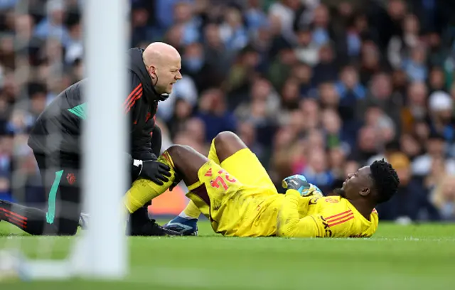 Andre Onana of Manchester United receives medical treatment