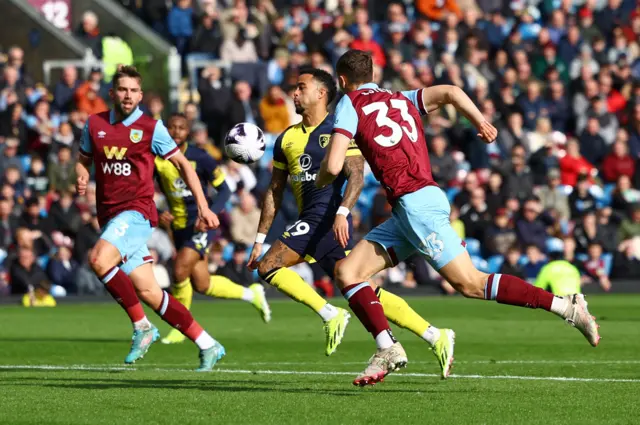 Justin Kluivert in action with Burnley's Charlie Taylor and Maxime Esteve
