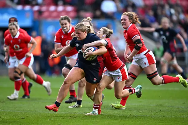 Connie Powell of England is tackled by Keira Bevan