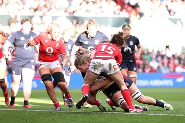 Zoe Aldcroft takes the ball into contact