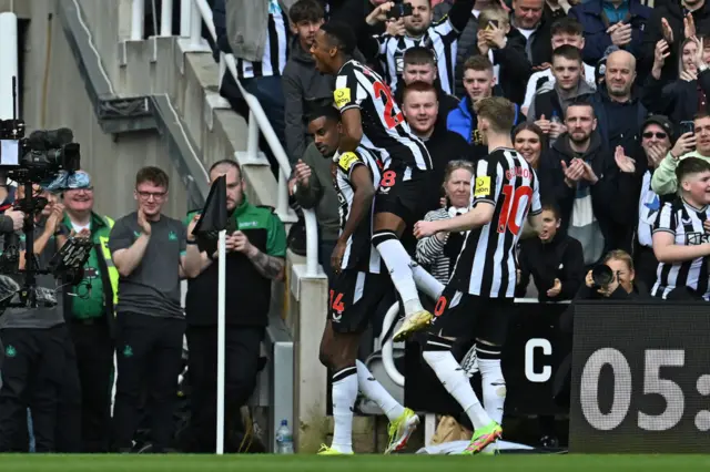 Isak is mobbed by teammates after opening the scoring