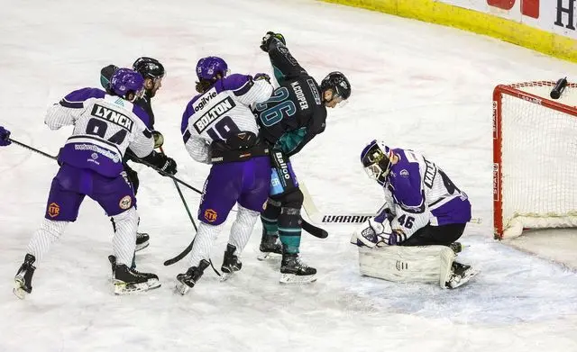 Mark Cooper's shot being saved by Antti Karjalainen