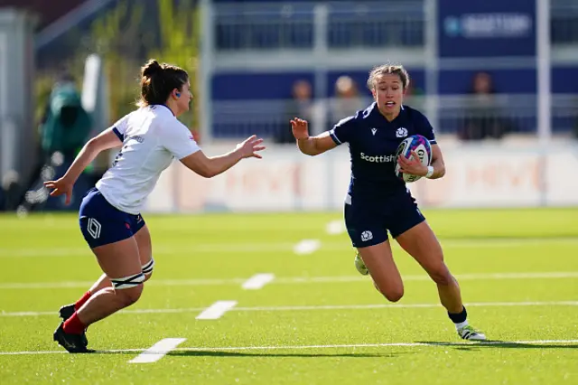 Rhona Lloyd runs with the ball