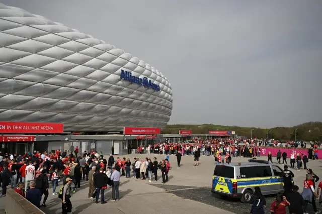 General view as fans queue up to enter Bayern Munich's Allianz Arena