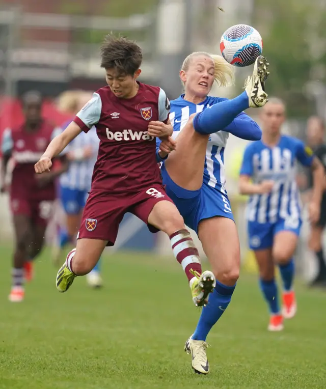 Ueki battles with Bergsvand for the ball