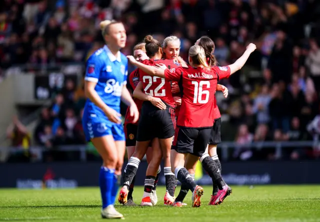 Utd celebrate as Bennison commiserates in the foreground
