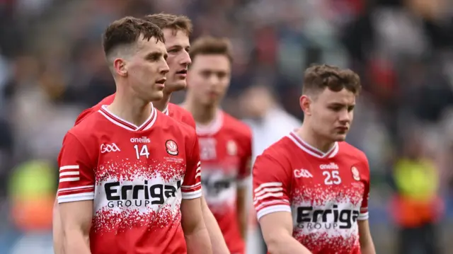 Derry players leave the pitch