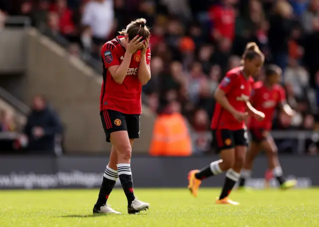 Ella Toone puts her hands to her face in anger