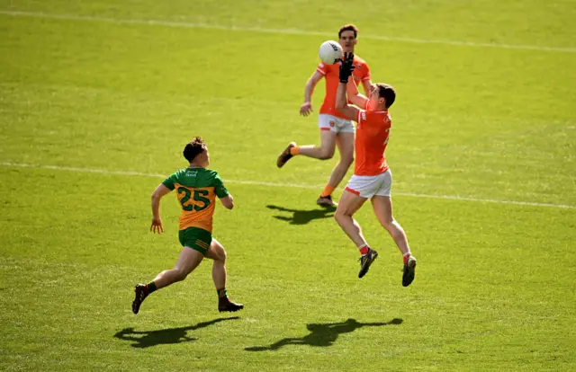 Paddy Burns of Armagh in action against Luke McGlynn of Donegal