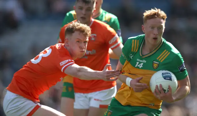 Armagh's Conor Turbitt tackles Oisín Gallen